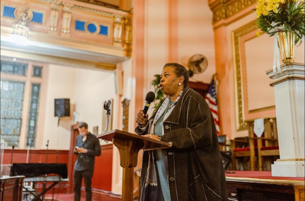 woman speaking at event-for press release page